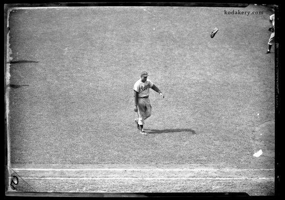Vintage 5x7 negative of Brooklyn Dodger pitcher Don Newcombe throwing his glove in the air after being removed from a game
